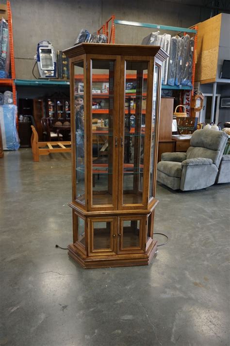 72h x 26w x 13d. WOODEN CURIO CABINET W/ LIGHTS - Big Valley Auction