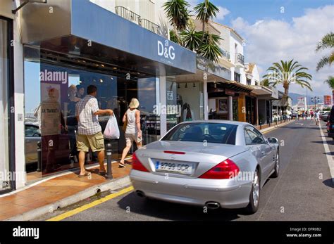 Luxury Car And Shops At The Exclusive Yacht Harbour Of Puerto Banús