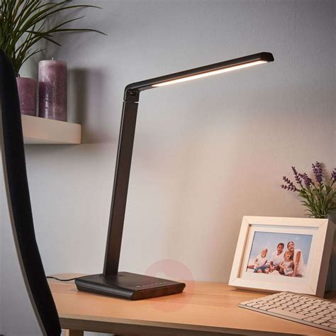 Led desk lamps help users write, read, and work at their desks without any eye strain or glare. Kuno - LED desk lamp with USB port | Lights.co.uk