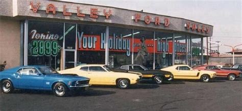 Classic 60s Ford Dealership With Ford Mustangs In A Row Ford Torino