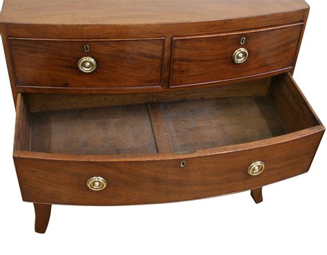 A Small Antique Regency Mahogany Bow Front Chest Of Drawers