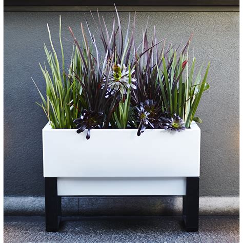 The santino latina self watering planter is made from a uv resistant plastic material, which makes it a good option for both indoor and outdoor use. Glowpear Rectangular Planter Box & Reviews | Wayfair