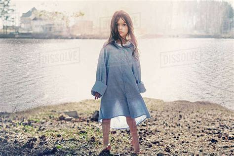 Caucasian Girl Standing At Rural Lake Stock Photo Dissolve
