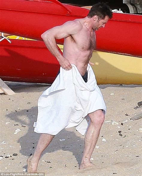 Hugh Jackman Shows Off His Bulging Biceps And Ripped Abs As He Goes Shirtless While Enjoying