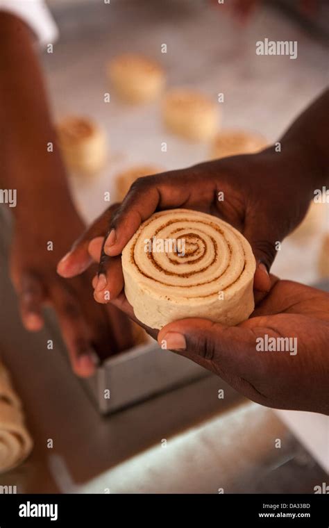 African American Women Making Cinnamon Buns From Scratch Stock Photo