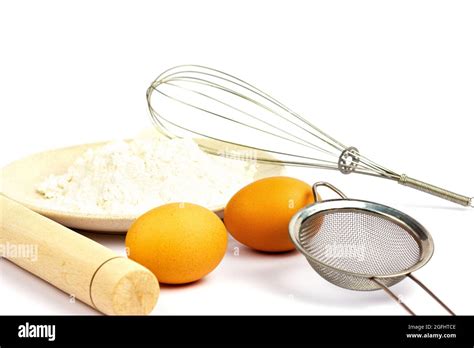 Rolling Pin For Dough Egg Flour Whisk Strainer On A White