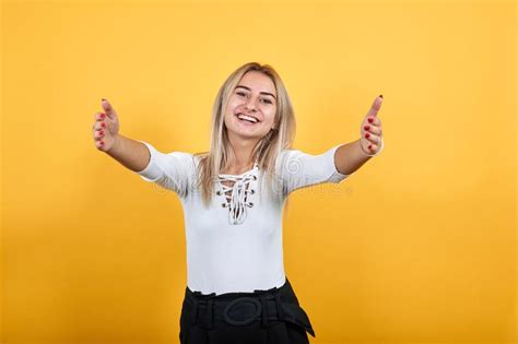 Attractive Caucasian Young Woman Spreading Hands And Looking So Funny Pretty Stock Image