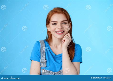 close up satisfied tender grinning cute redhead girl look cute lovely camera touch cheek