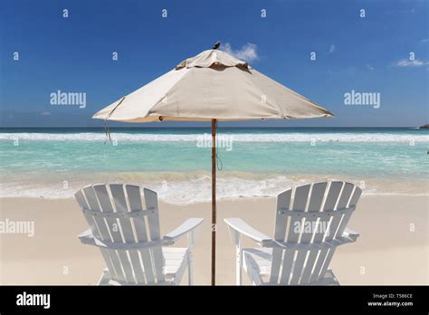 Summer Vacations Tropical Beach With Chairs And Umbrella Stock Photo