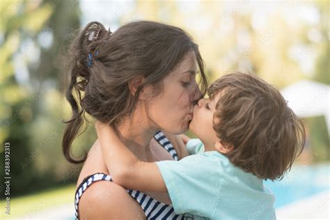 Mother Kissing Son In Garden Outdoors Images Stock Photo Adobe Stock