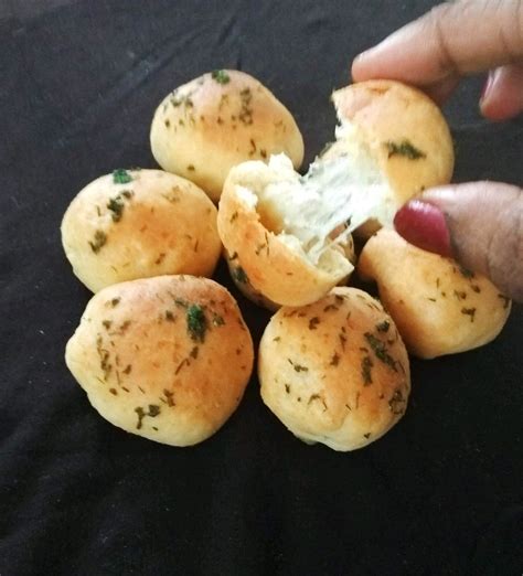 Garlic herb cheese bombs are stuffed with mozzarella cheese then baked to golden brown perfection. Garlic Cheese Bombs recipe | Rekha Unni recipes | Recipebook