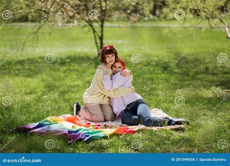 In The Park Lesbian Two Ladies Have A Picnic They Eating Fruits And Enjoy The Good Weather