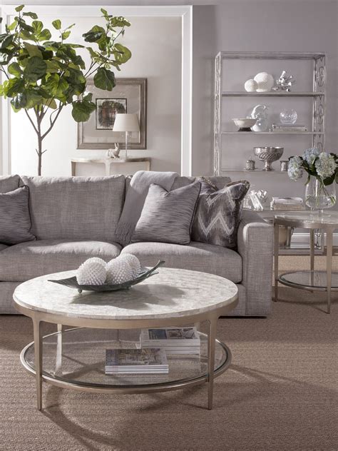 Pieces of reclaimed wood form a richly grained mosaic on this coffee table. Gravitas Round Cocktail Table | Coffee table, 3 piece ...