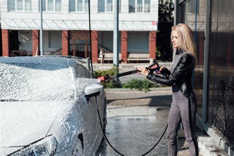 beautiful blonde woman washes her car at car wash stock image image of lather glamour 202081295