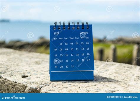 Blue January 2024 Calendar On Blurred Background Of Blue Ocean Stock