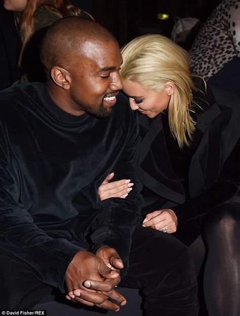 Kim Kardashian And Kanye West Pucker Up At The Louis Vuitton Foundation