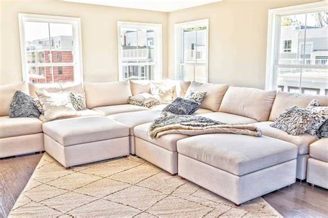 The rug is placed under 3/4 of the bed, but could be pulled out further to cover the bottom 2/3 of the bed for placement of a decorative bench at the end of the bed. How to Place a Rug Under a Sectional Sofa - Home Decor Bliss