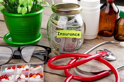 Saving Money For Health Care Insurance Money Glass Stethoscope