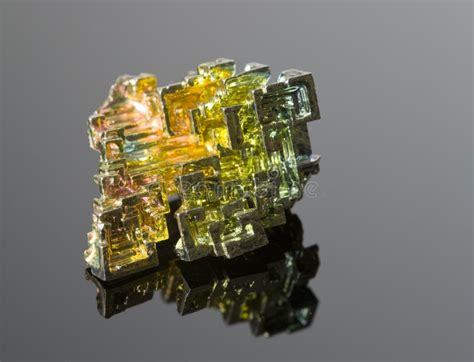The Mineral Bismuth On A Black Reflective Surface Stock Photo Image