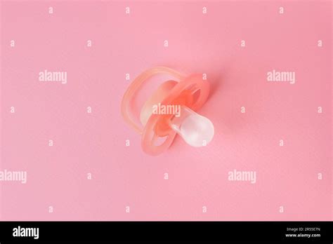 New Baby Pacifier On Pink Background Top View Stock Photo Alamy