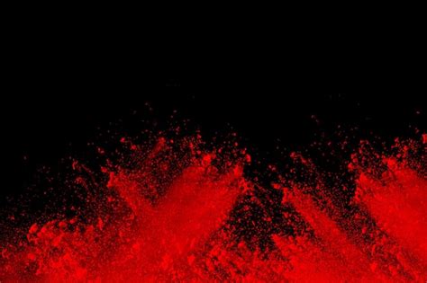 Premium Photo Abstract Red Dust Explosion On Black Background