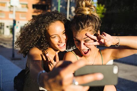 Female Friends Taking A Selfie By Stocksy Contributor Michela