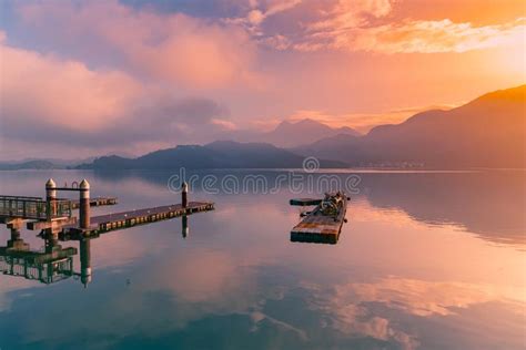 Beauty Sunrise Sky Over Frozen Water Lake Between Hills Stock Image