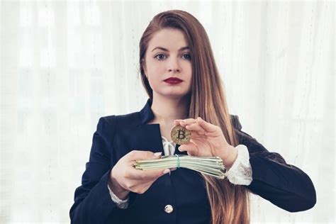 Premium Photo Beautiful Young Woman Showing Bitcoin And Dollar Banknotes