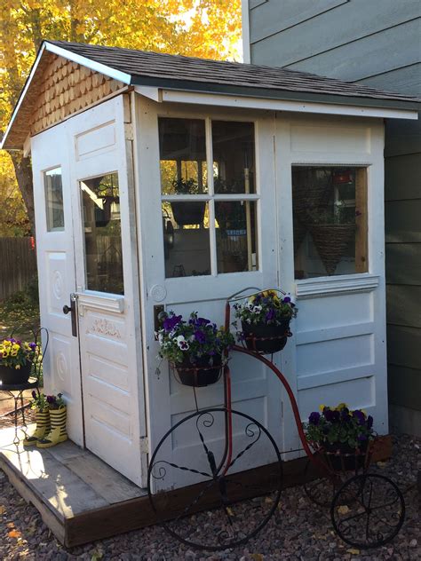 This fairytale garden shed utopia was made using recycled materials such as weathered wood, windows from an old milking barn, old rust hinges, old chair, old bear trap on the wall, old garden tools, old door, a rusty horse shoe to hook the door etc. Salvaged doors for garden/potting shed | Garden shed diy ...
