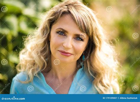 Close Up Portrait Of Beautiful Smiling Blonde 40 Years Old Woman In