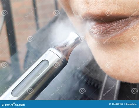 woman with vaping e cigarette blowing vape cloud closeup stock image image of trend atomizer
