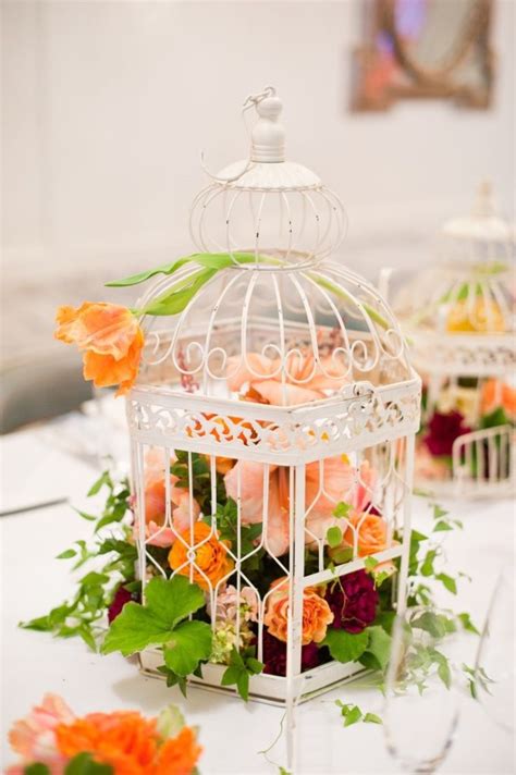 Outdoors, a bird cage can be used as a hanging planter or bohemian decor piece. 25 Truly Amazing Birdcage Wedding Centerpieces (with ...