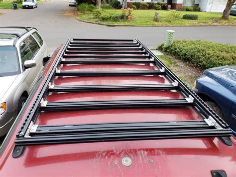 I have the same premise for my diy rack (easy to build and bolts together), but a lot simpler. DIY Aluminum Roof Rack Build - YotaTech Forums