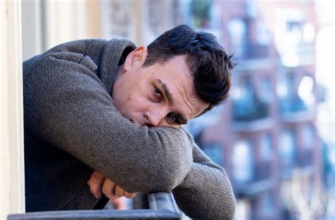Portrait Of Young Unhappy Depressed Lonely Man Looking Stressed Leaning