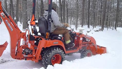 Kubota Bx25d Snow Plowing With Bucket Youtube