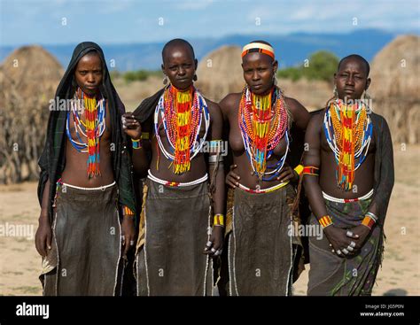 portrait of erbore tribe women with black veils and colourful necklaces omo valley murale