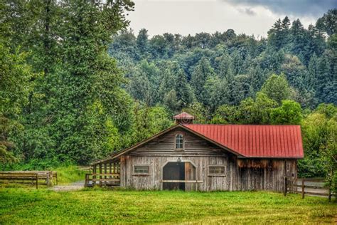 A Scenic Barn Surrounded By Trees And Flowers Stock Photo Image Of