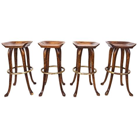 Stylish bar stools provide a sense of authenticity and comfort to your home bar or kitchen counter experience. Set of Four Counter Height Bar Stools by Jean of Topanga ...