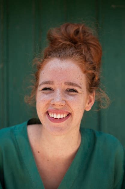 Free Photo Beautiful Smiling Redhead Woman Looking At Camera