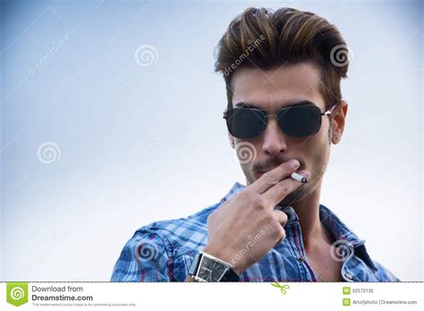 Trendy Cool Young Man Standing Outside Smoking Stock Image - Image of attractive, outside: 52572135