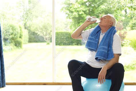 Older Man Drinking Water During Exercise Stock Image F0041113