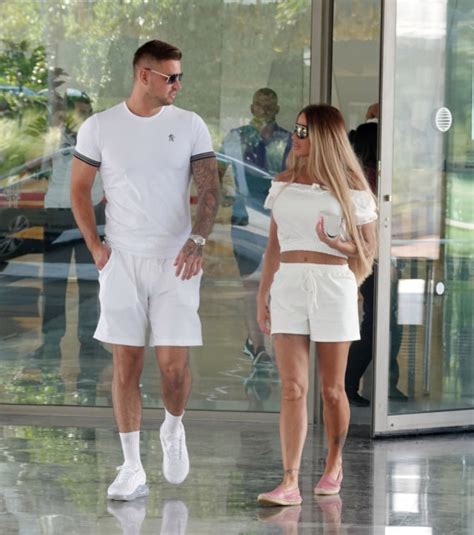 Katie Price And New Boyfriend Carl Woods Match In All White Outfits As