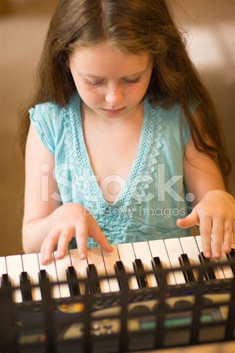 Little Girl Play Piano Stock Photos