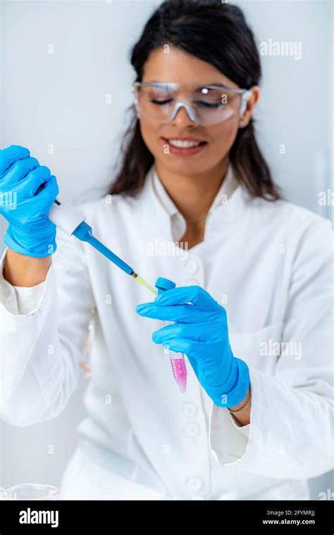Researcher Pipetting Sample Stock Photo Alamy