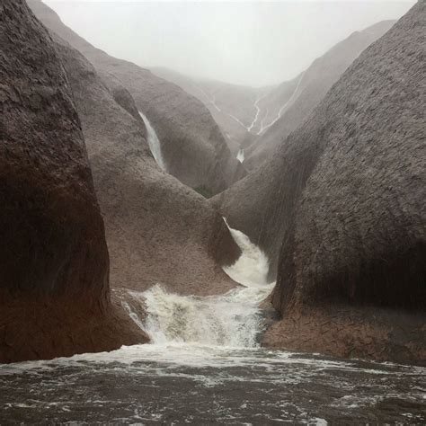 Uluru Became A Massive Waterfall After Extreme Rains Flooded The Australian Desert