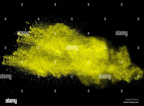 Abstract Yellow Dust Explosion On Black Background Abstract Yellow
