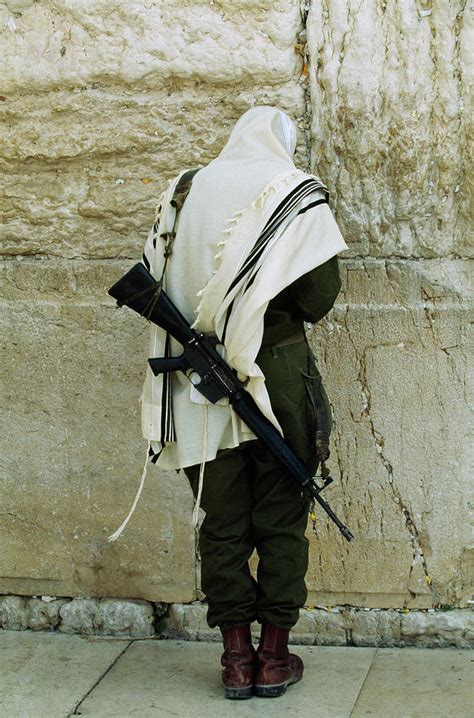 Israeli Soldier With Rifle Praying Photograph By Paul Chesley