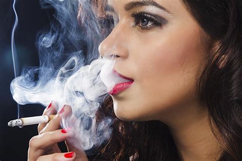 Indian Glamorous Young Beautiful Latin Woman Smoking Cigarette Smoke From Mouth