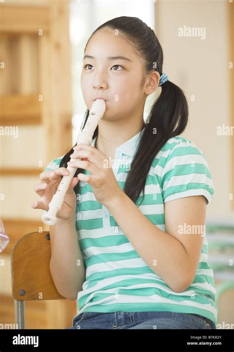 Elementary School Girl Playing Recorder Stock Photo Alamy