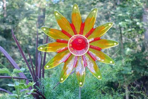 Each Unique Garden Art Piece Has Been Made With Glassware To Create